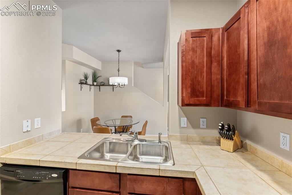 4073 Flash Point Colorado Springs, CO 80907 - Photo 8 of 20 a bathroom with a sink and a mirror