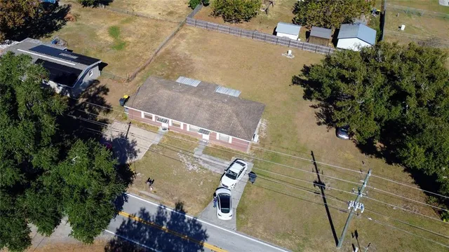 an aerial view of residential houses with outdoor space