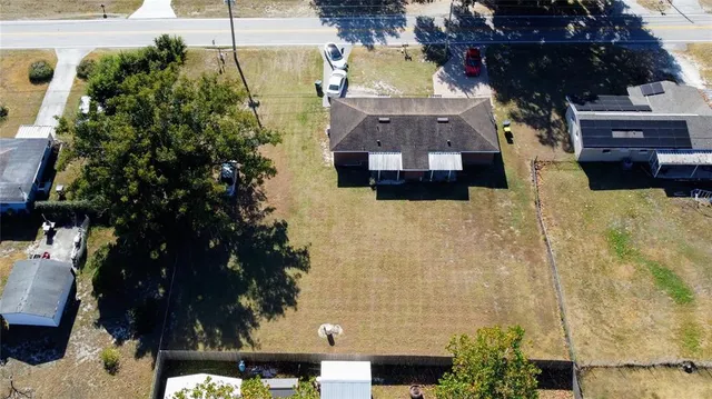 an aerial view of a house with a garden