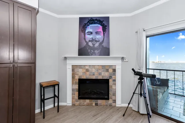 a living room with furniture a rug and a painting on the wall