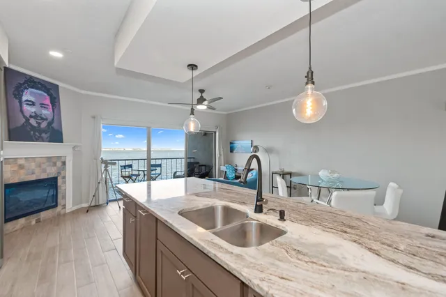 a kitchen with stainless steel appliances granite countertop a refrigerator and a stove