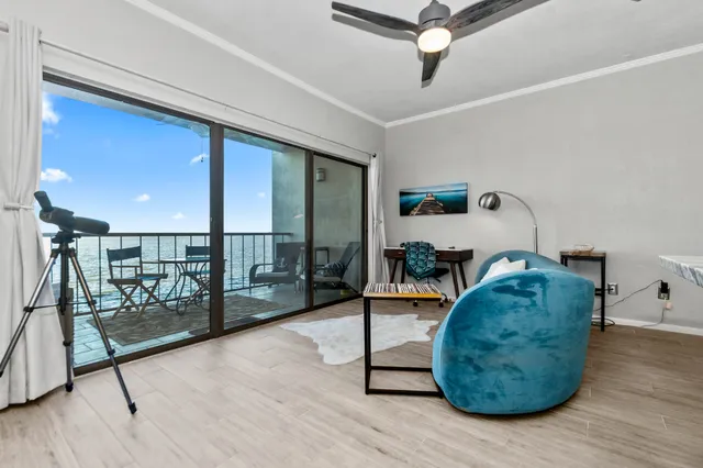 a view of an ocean beach and mountain