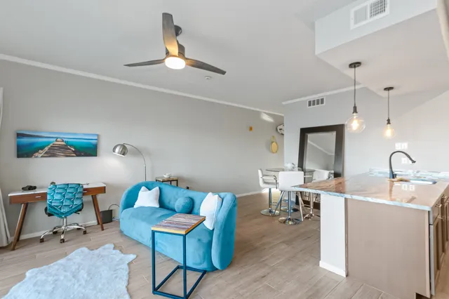 a kitchen with stainless steel appliances granite countertop a sink and a refrigerator