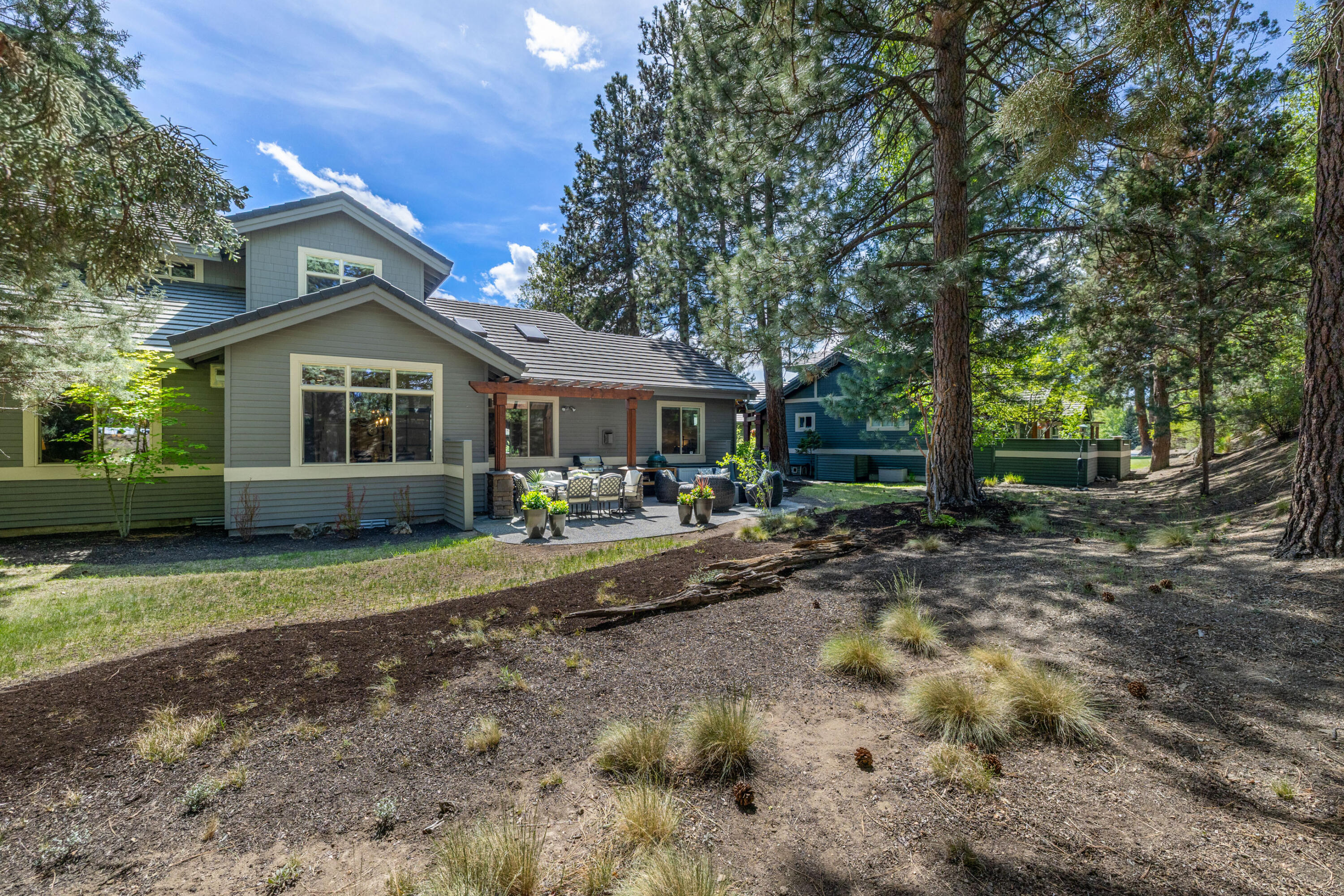 19460 Chip Shot Lane Bend, OR 97702 - Photo 47 of 56 a front view of a house with a yard