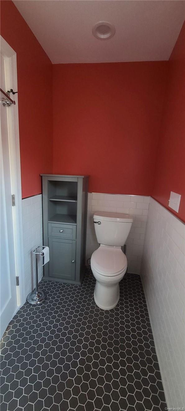 11 Curry Road Mahopac, NY 10541 - Photo 14 of 25 Bathroom featuring tile floors, toilet, and heated tile walls