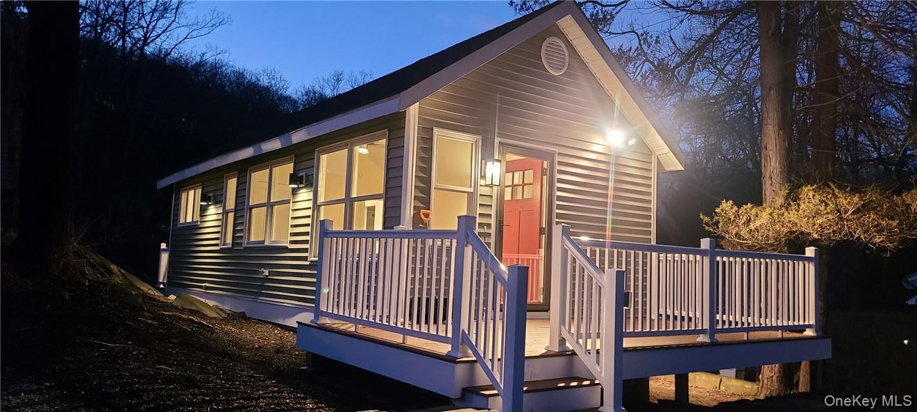 11 Curry Road Mahopac, NY 10541 - Photo 2 of 25 View of home's exterior with a wooden deck at night