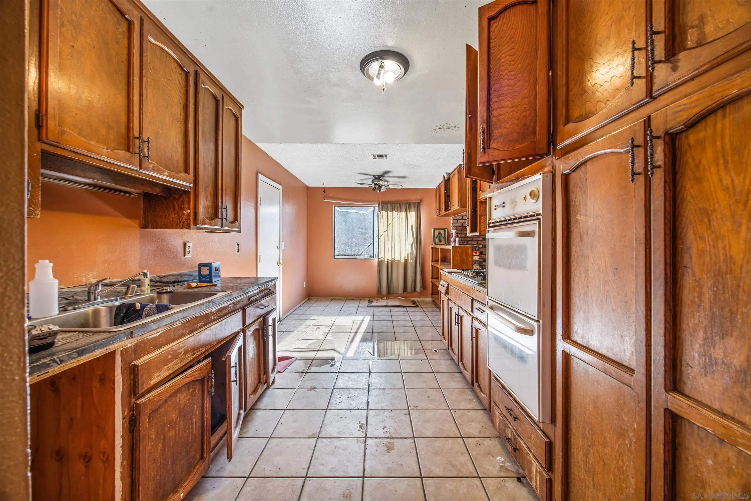 9048 Gideon Circle South Lakeside, CA 92040 - Photo 4 of 21 a kitchen with stainless steel appliances granite countertop a refrigerator a stove and a sink