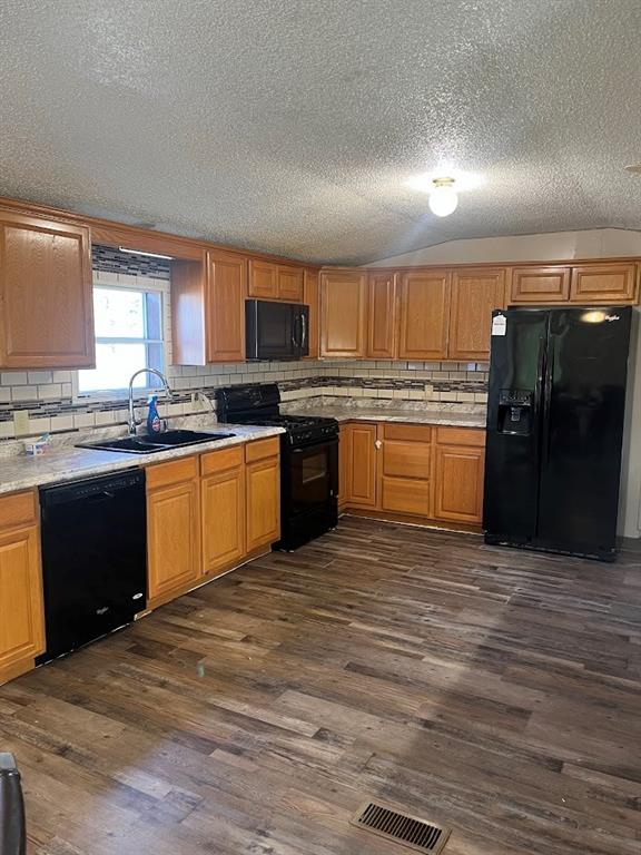 272 Duff Street Bobtown, PA 15315 - Photo 11 of 26 a kitchen with stainless steel appliances granite countertop a sink cabinets and wooden floor