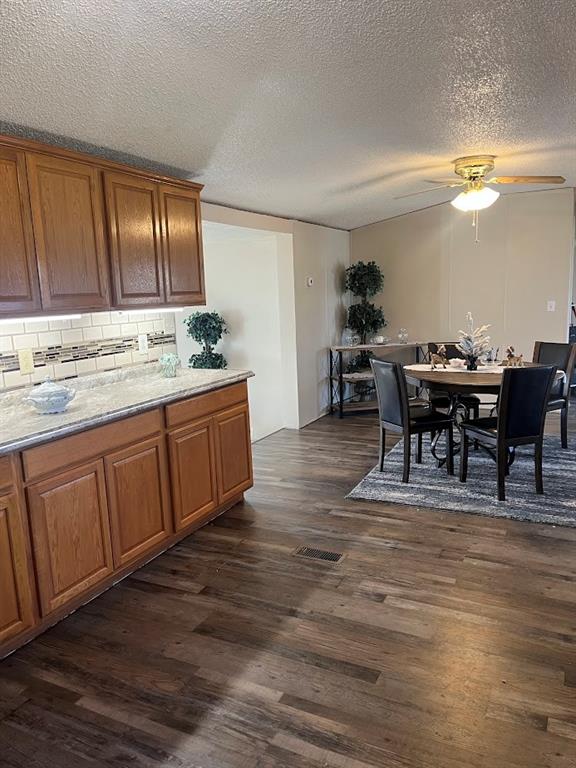 272 Duff Street Bobtown, PA 15315 - Photo 12 of 26 a view of a kitchen with kitchen island dining table and wooden floor