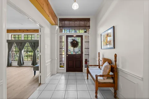 a view of a hallway with seating area