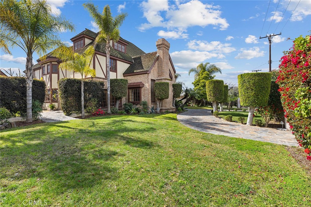 11550 183rd Street Artesia, CA 90701 - Photo 2 of 67 a view of a building and a yard