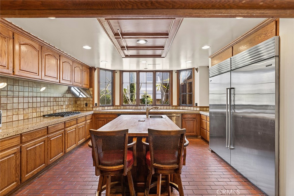 11550 183rd Street Artesia, CA 90701 - Photo 22 of 67 a kitchen with stainless steel appliances granite countertop a sink and a refrigerator