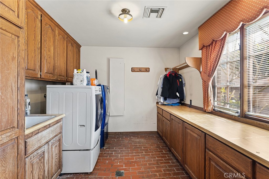 11550 183rd Street Artesia, CA 90701 - Photo 30 of 67 a kitchen with stainless steel appliances granite countertop a refrigerator and a stove