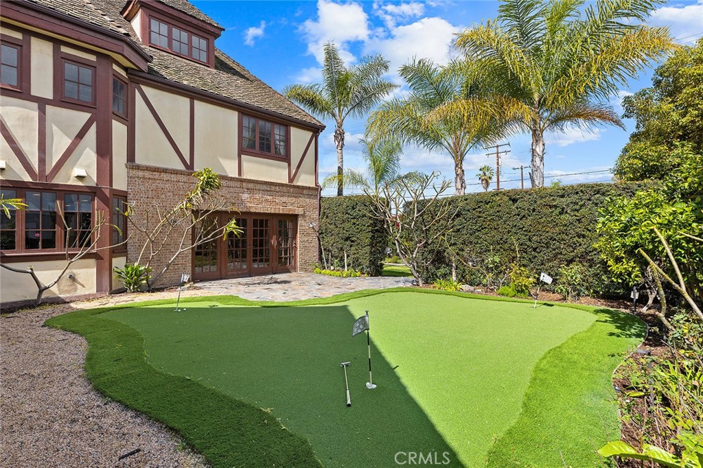 11550 183rd Street Artesia, CA 90701 - Photo 3 of 67 a view of a house with a swimming pool