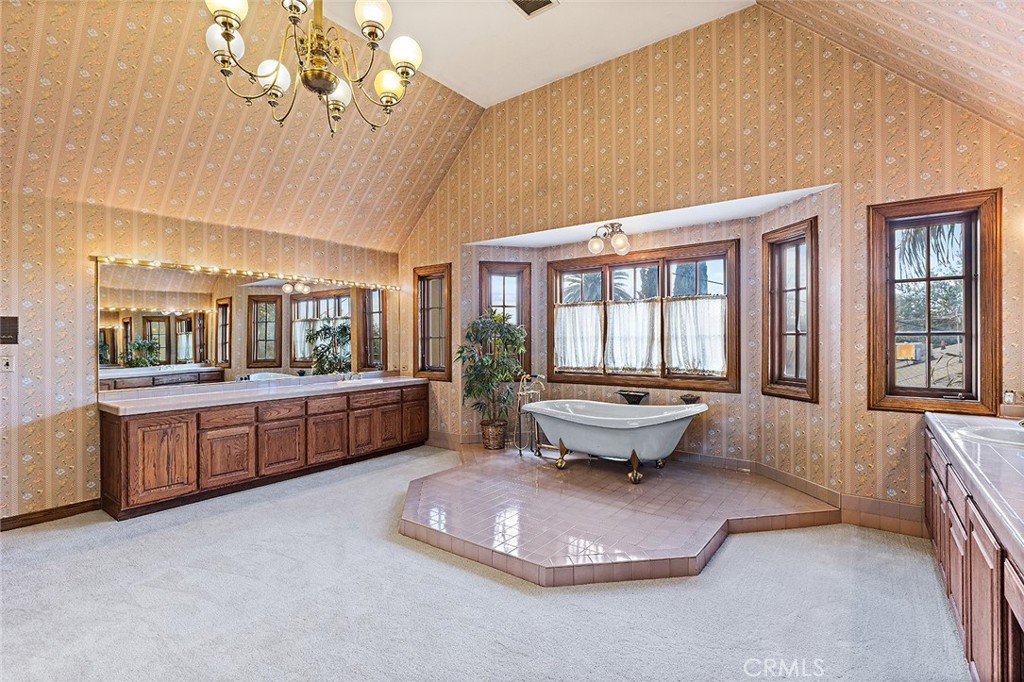 11550 183rd Street Artesia, CA 90701 - Photo 37 of 67 a bathroom with a sink mirror and window