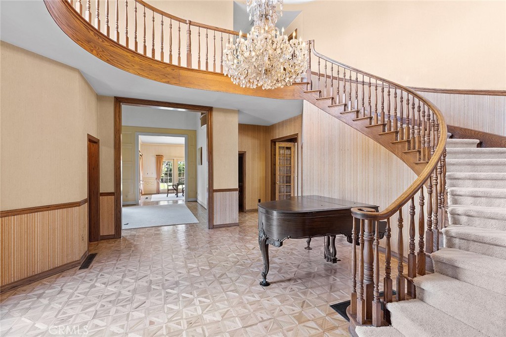 11550 183rd Street Artesia, CA 90701 - Photo 4 of 67 a view of a hallway with dining room and stairs