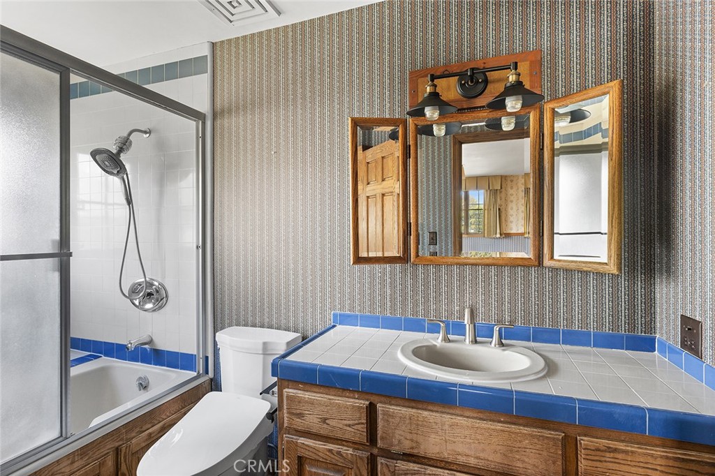 11550 183rd Street Artesia, CA 90701 - Photo 42 of 67 a bathroom with a sink and a mirror