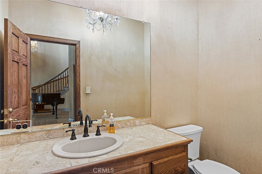 11550 183rd Street Artesia, CA 90701 - Photo 48 of 67 a bathroom with a sink and a mirror