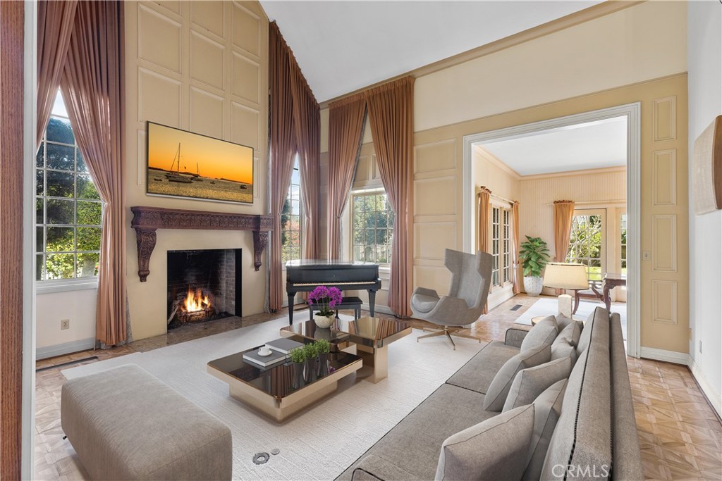 11550 183rd Street Artesia, CA 90701 - Photo 5 of 67 a living room with furniture a window and a fireplace
