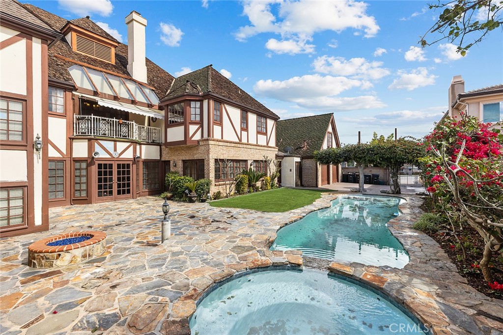 11550 183rd Street Artesia, CA 90701 - Photo 54 of 67 a front view of a house with a yard