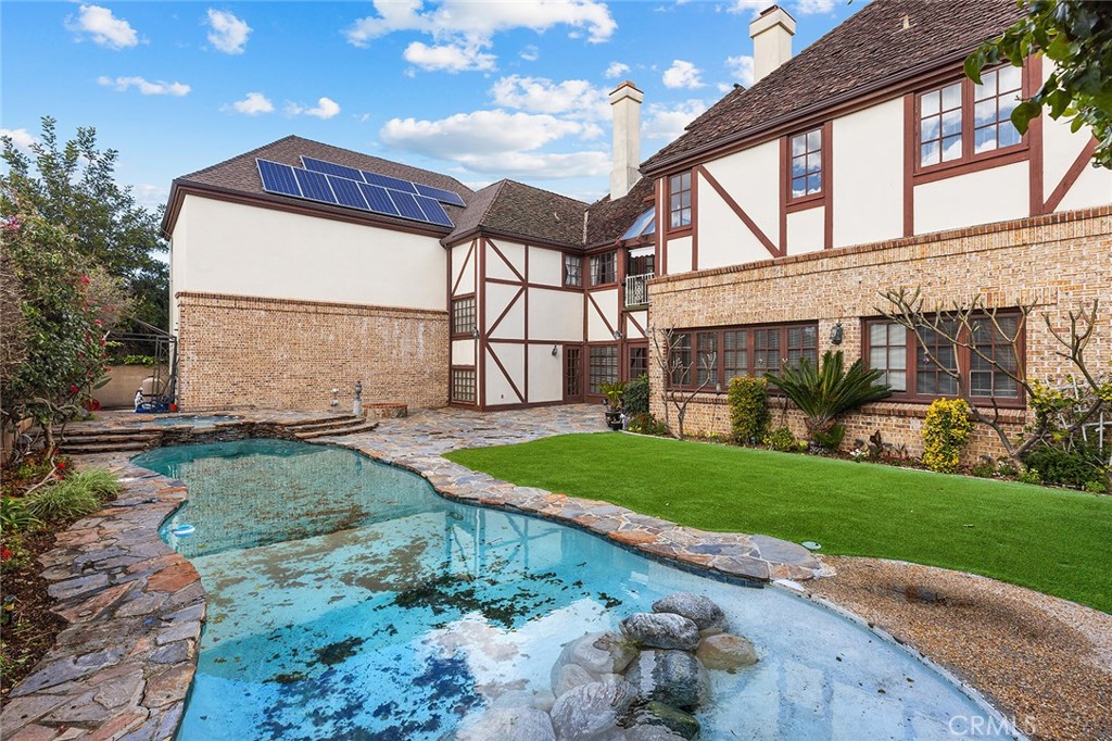 11550 183rd Street Artesia, CA 90701 - Photo 55 of 67 a front view of a house with garden