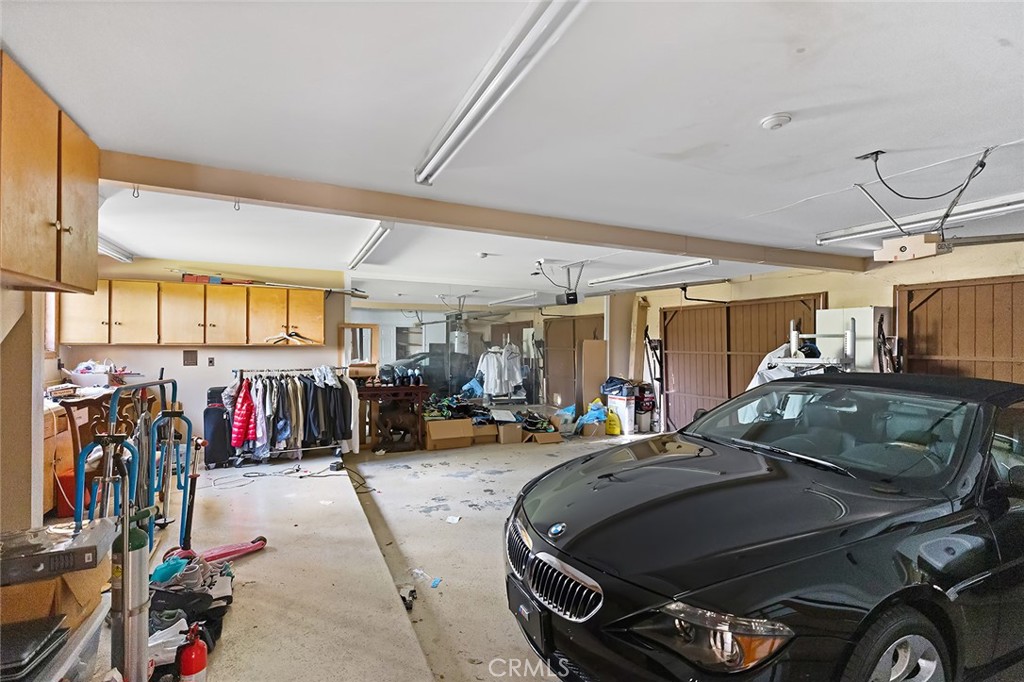 11550 183rd Street Artesia, CA 90701 - Photo 56 of 67 garage space with workbench and storage