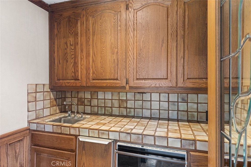 11550 183rd Street Artesia, CA 90701 - Photo 9 of 67 a close view of a sink a stove and a microwave