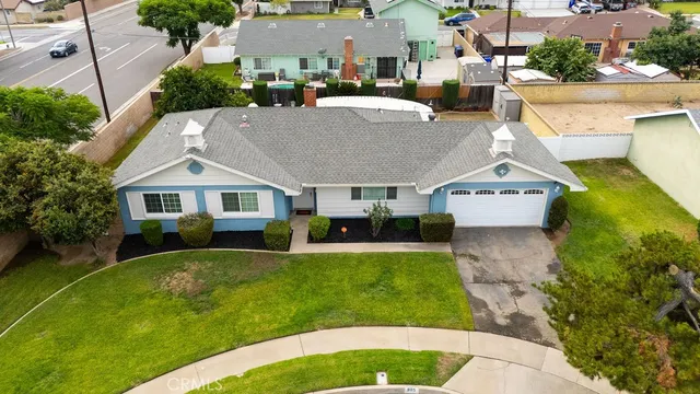 a aerial view of a house with a yard patio and swimming pool
