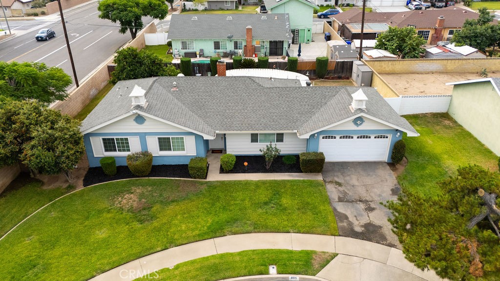 885 East Home Street Rialto, CA 92376 - Photo 25 of 26 a aerial view of a house with a yard patio and swimming pool