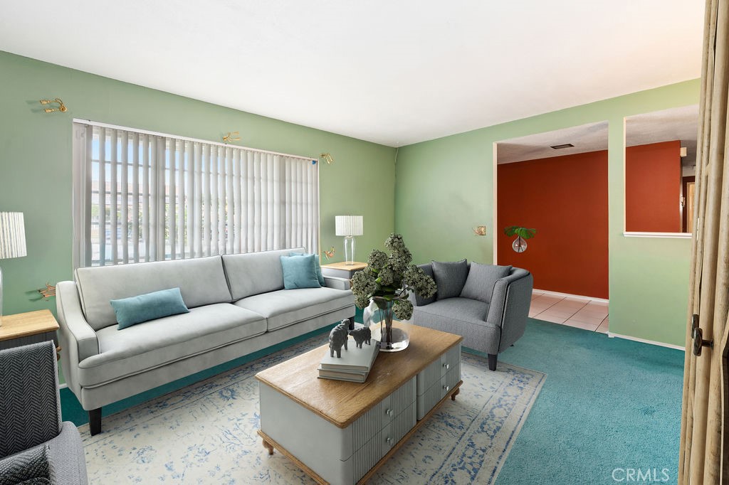 885 East Home Street Rialto, CA 92376 - Photo 4 of 26 a living room with furniture and a large window