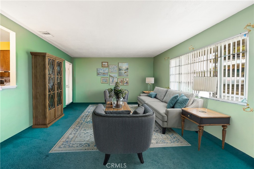 885 East Home Street Rialto, CA 92376 - Photo 6 of 26 a living room with furniture a window and a rug