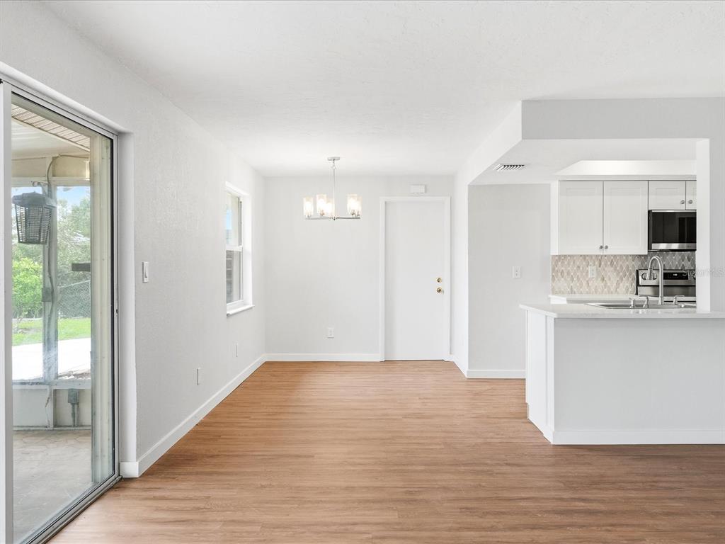 235 Pompano Terrace Punta Gorda, FL 33950 - Photo 11 of 30 a view of kitchen with wooden floor