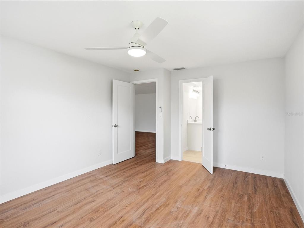235 Pompano Terrace Punta Gorda, FL 33950 - Photo 13 of 30 an empty room with wooden floor and window