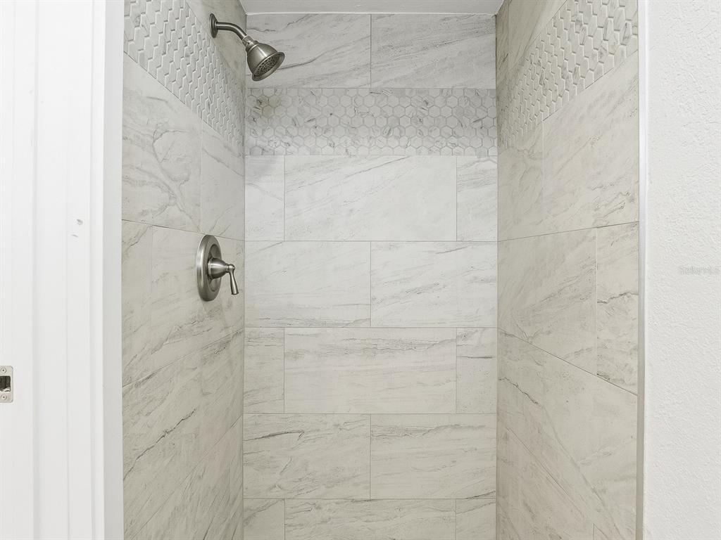 235 Pompano Terrace Punta Gorda, FL 33950 - Photo 15 of 30 a bathroom with a shower