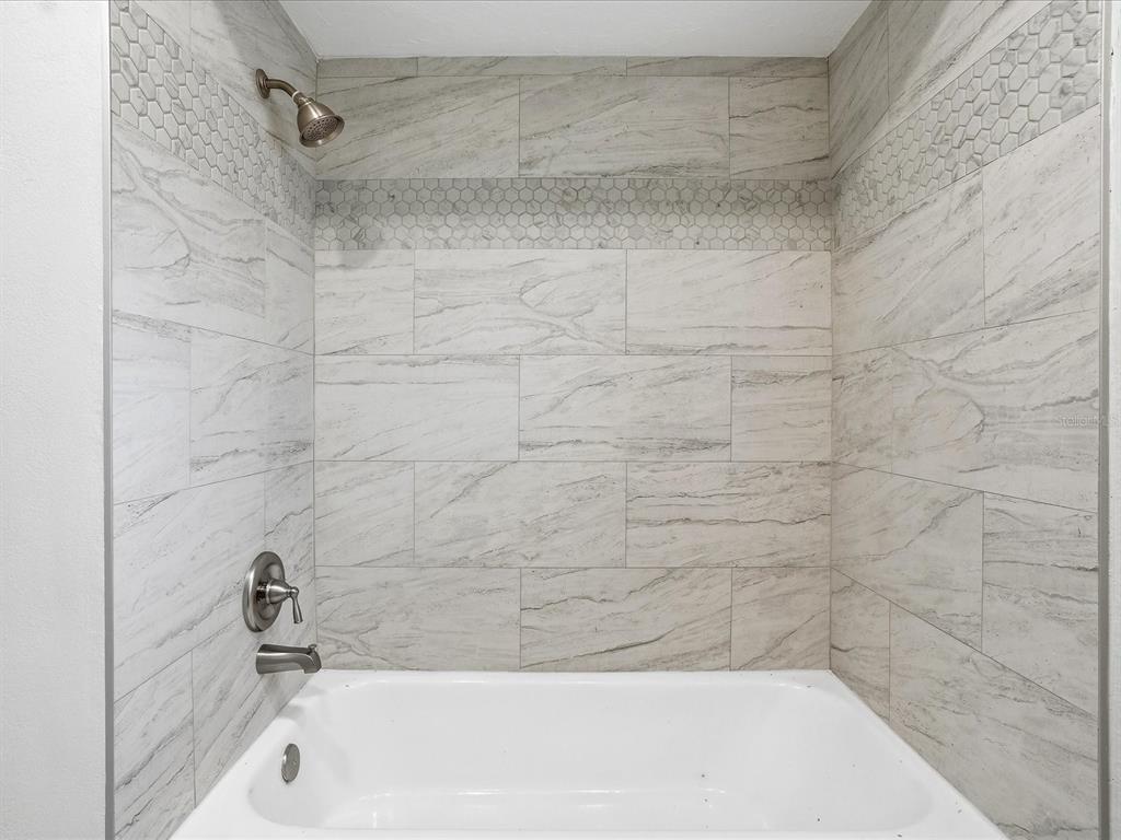 235 Pompano Terrace Punta Gorda, FL 33950 - Photo 19 of 30 a bathroom with a bathtub