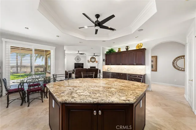 a dining table with chairs in it and wooden floor