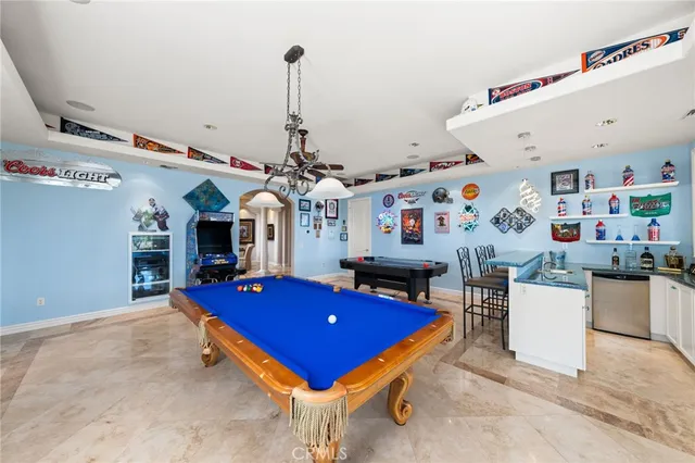 a room with gym equipment and flat screen tv