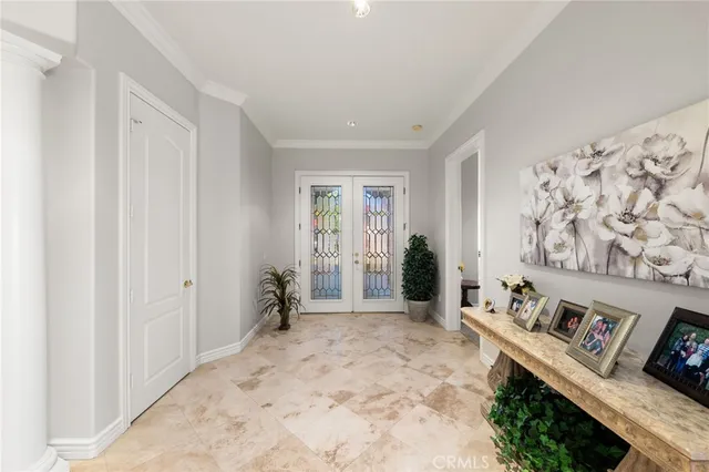 a view of a livingroom with wooden floor and furniture