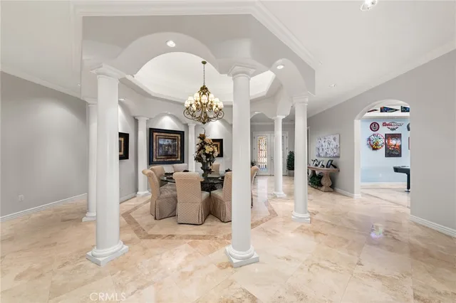 a view of a living room and chandelier