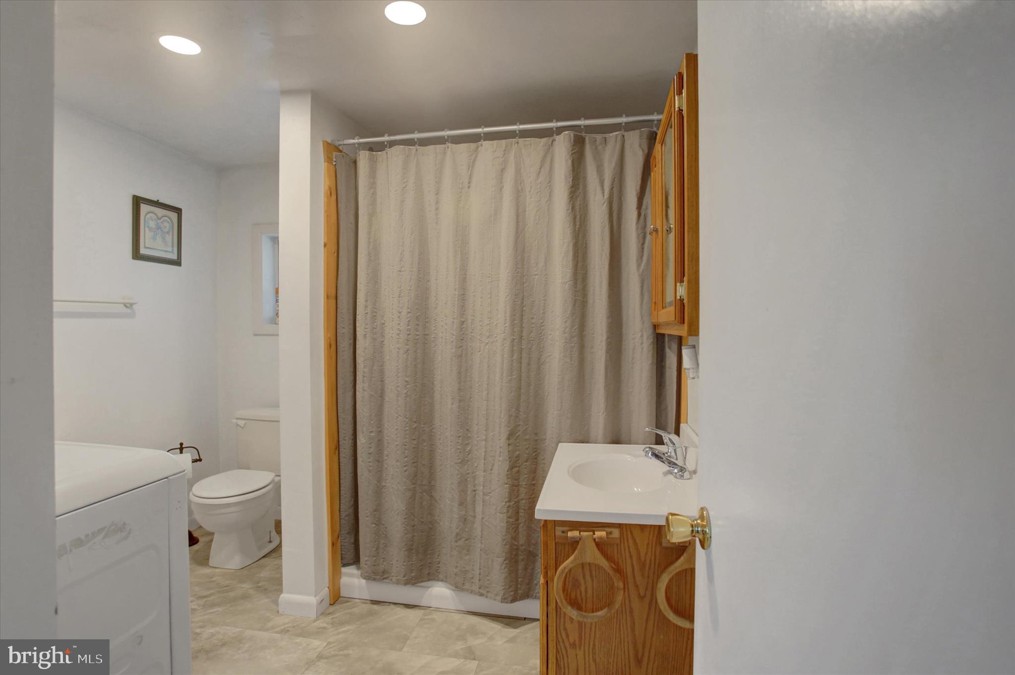 1611 Pine Road Carlisle, PA 17015 - Photo 18 of 45 a bathroom with a sink a toilet and tub