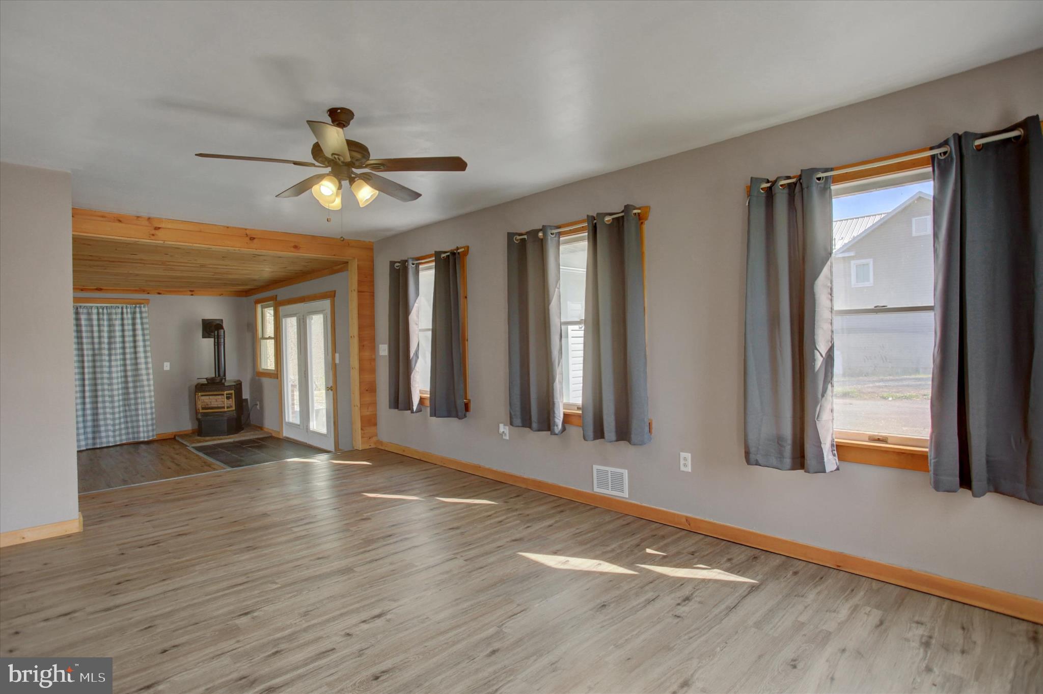 1611 Pine Road Carlisle, PA 17015 - Photo 22 of 45 a view of a livingroom with wooden floor and a ceiling fan