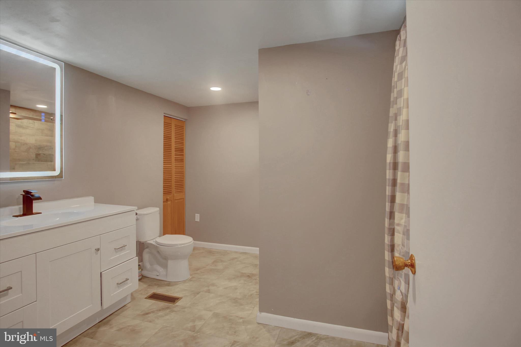 1611 Pine Road Carlisle, PA 17015 - Photo 30 of 45 a bathroom with a sink toilet and vanity