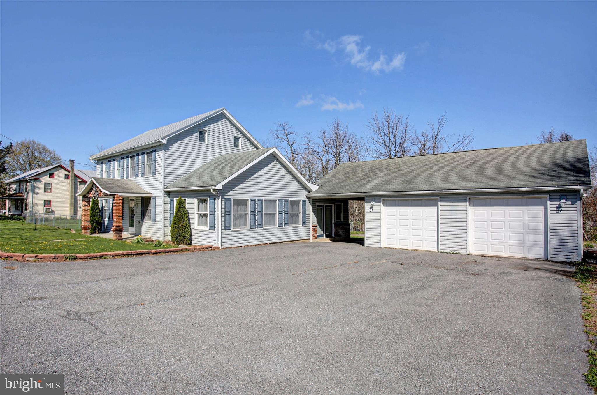 1611 Pine Road Carlisle, PA 17015 - Photo 3 of 45 a front view of a house with a yard and garage