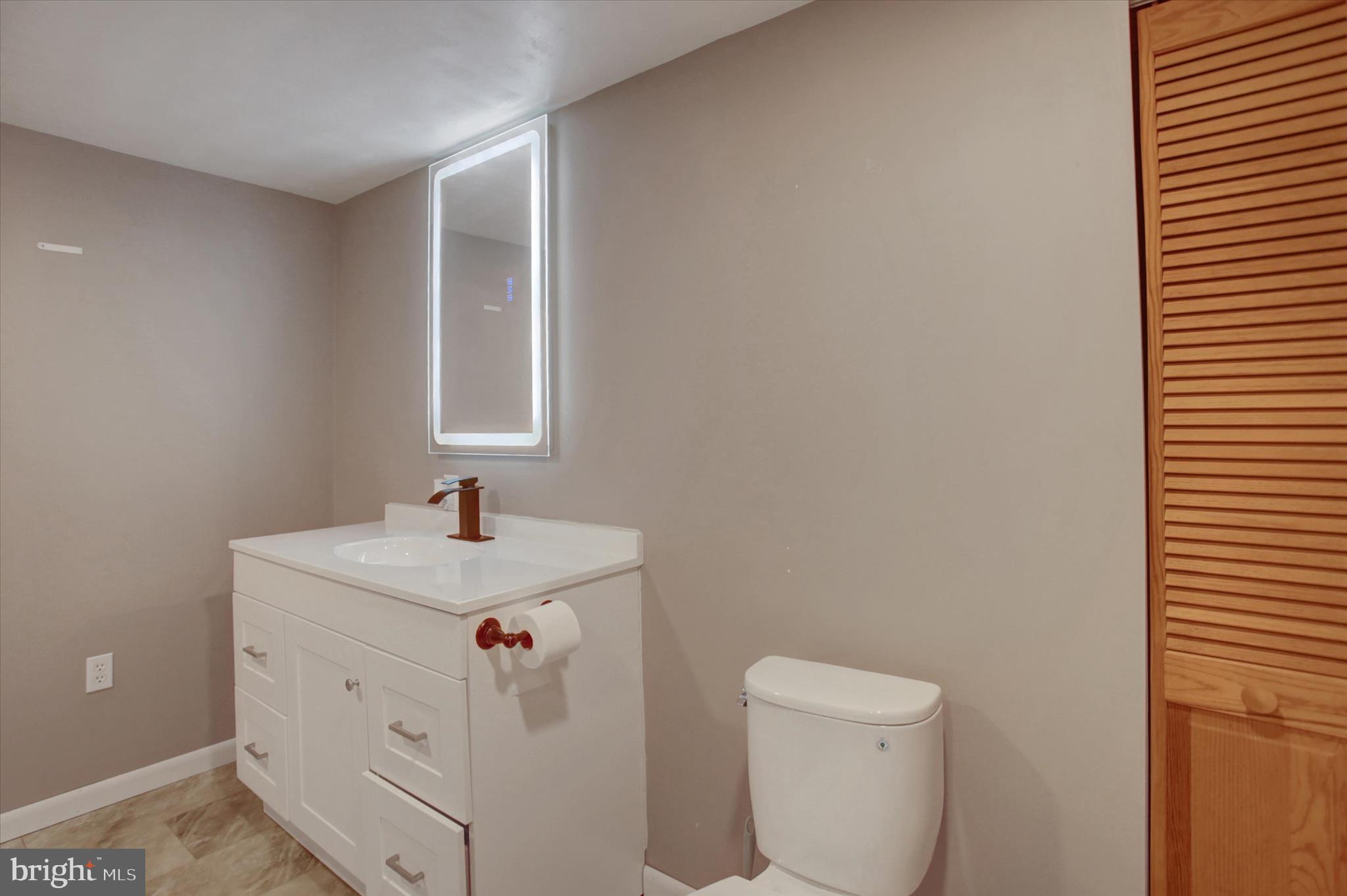1611 Pine Road Carlisle, PA 17015 - Photo 31 of 45 a bathroom with a sink toilet and window