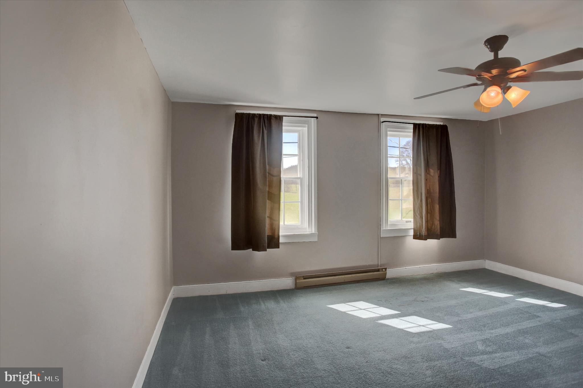 1611 Pine Road Carlisle, PA 17015 - Photo 33 of 45 an empty room with window and chandelier fan