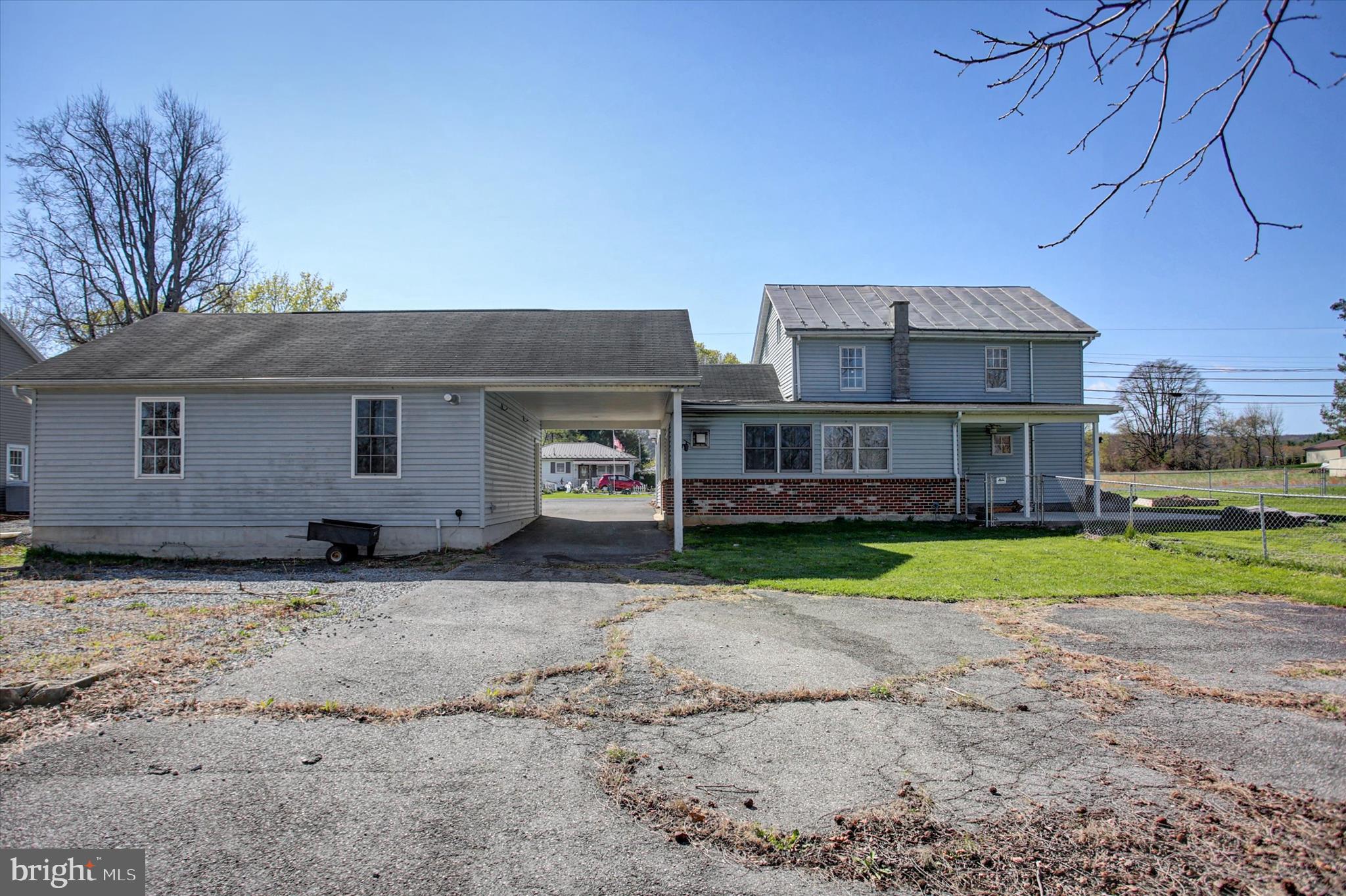 1611 Pine Road Carlisle, PA 17015 - Photo 39 of 45 a front view of a house with a yard and garage