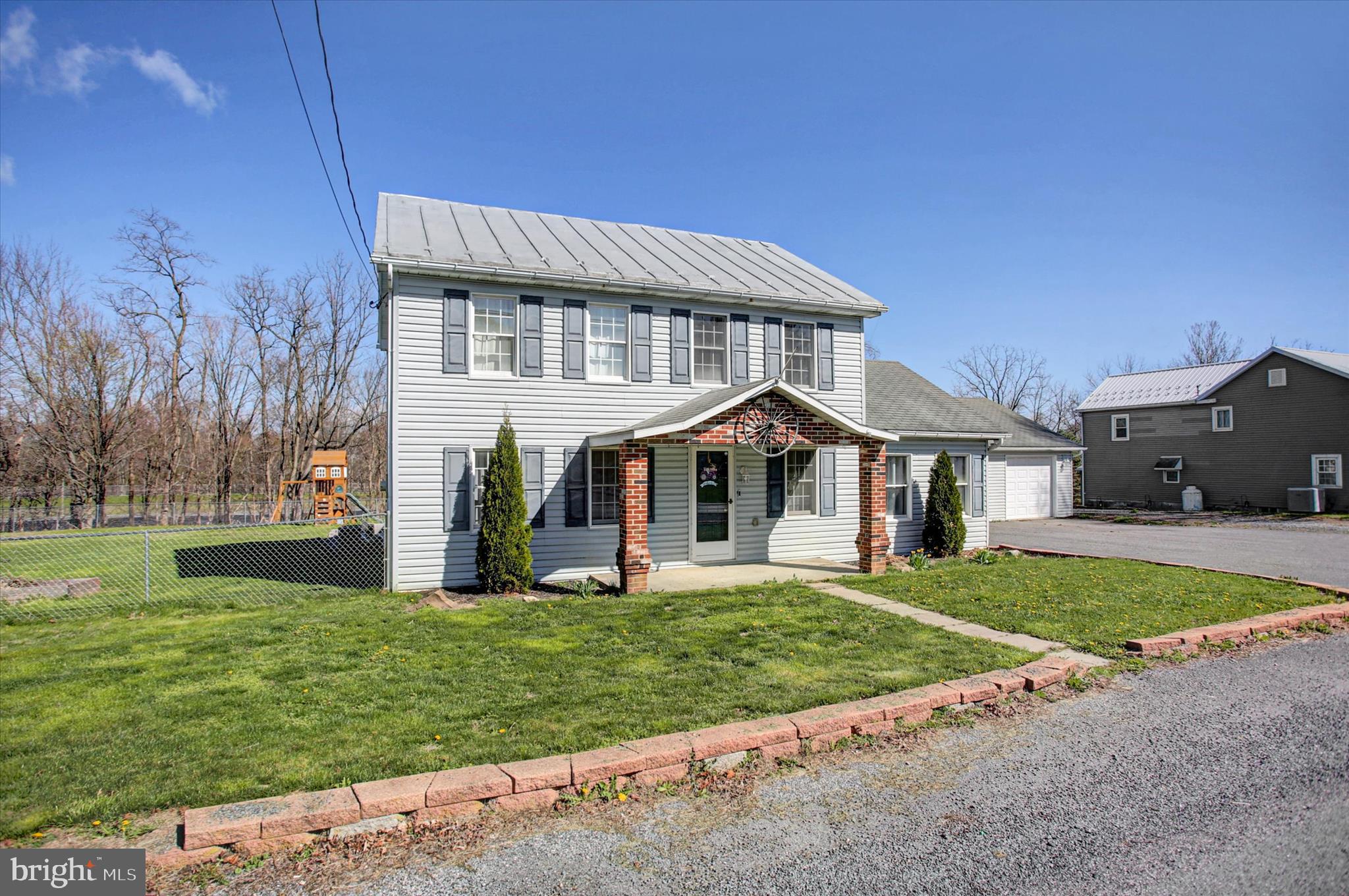 1611 Pine Road Carlisle, PA 17015 - Photo 4 of 45 a front view of a house with a garden