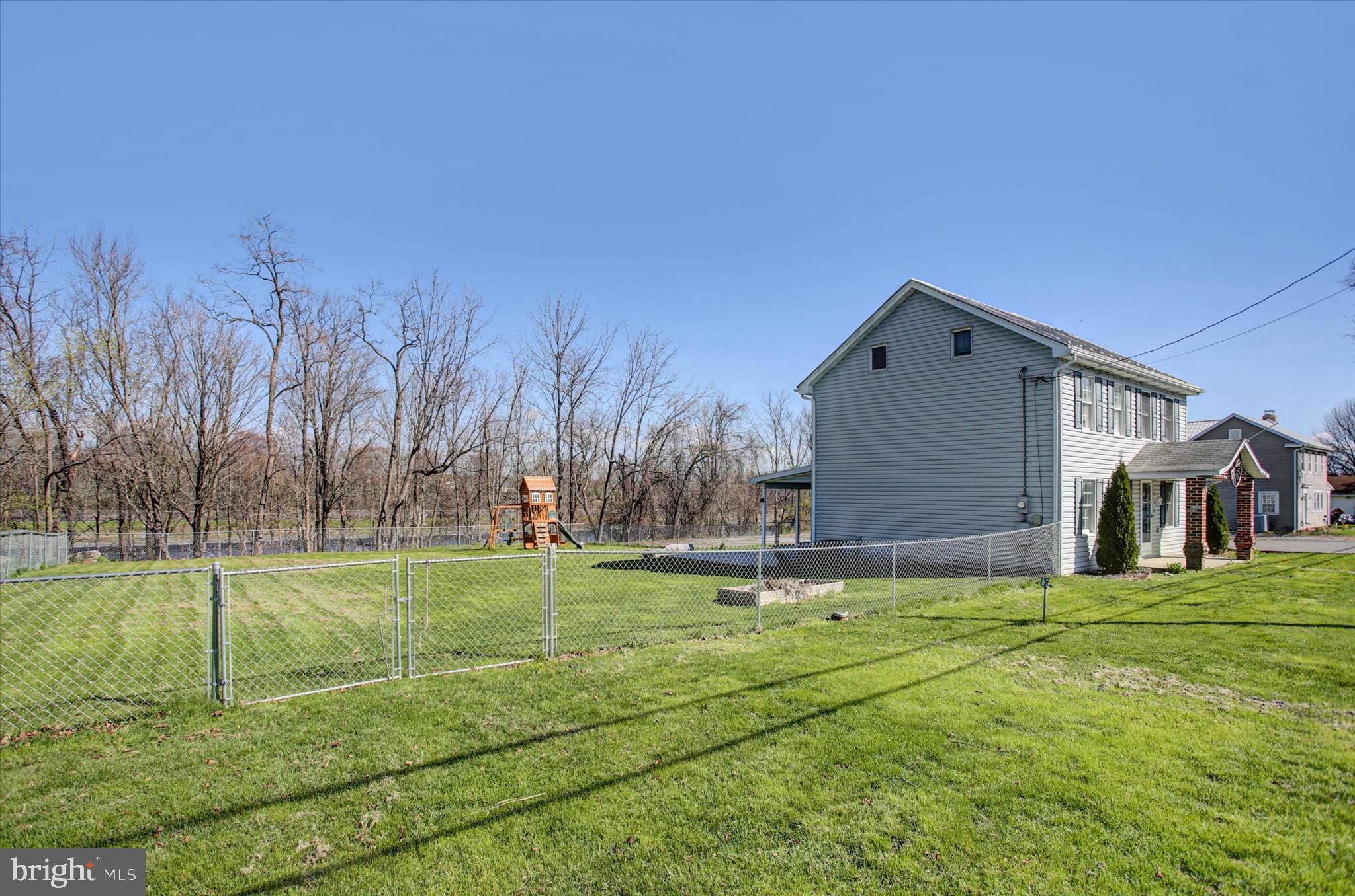 1611 Pine Road Carlisle, PA 17015 - Photo 5 of 45 a front view of a house with a yard
