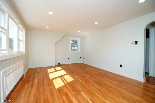 a view of a livingroom with wooden floor