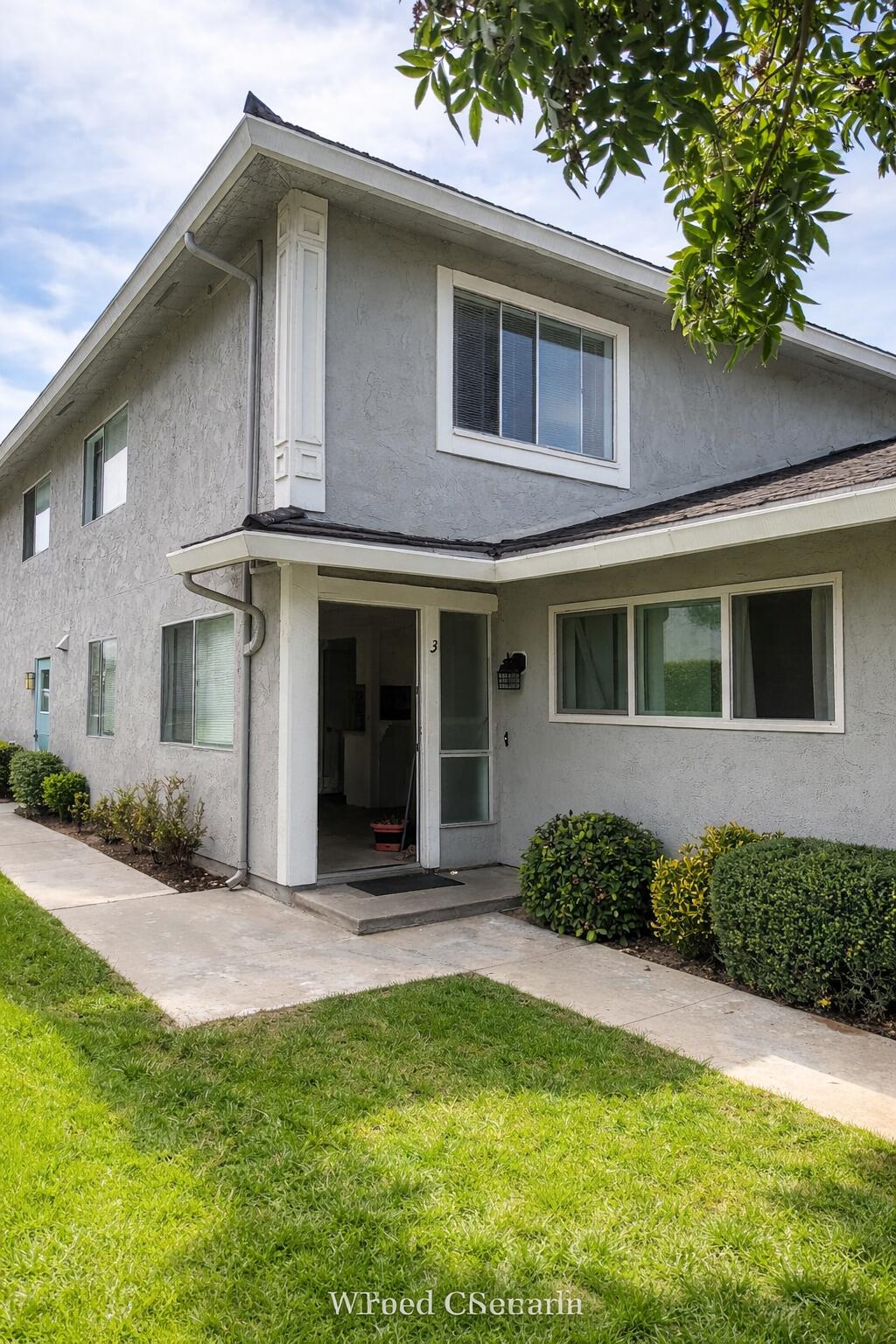 5935 Hickory Street, Unit 3 Carpinteria, CA 93013 - Photo 2 of 10 a front view of a house with a yard